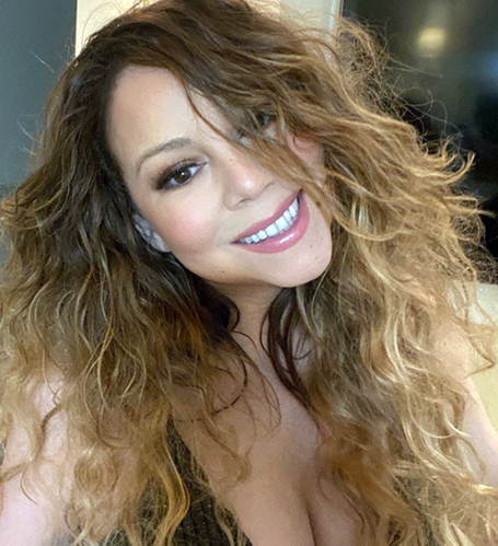 Mariah Carey shows off her throwback curls | mcarchives.com