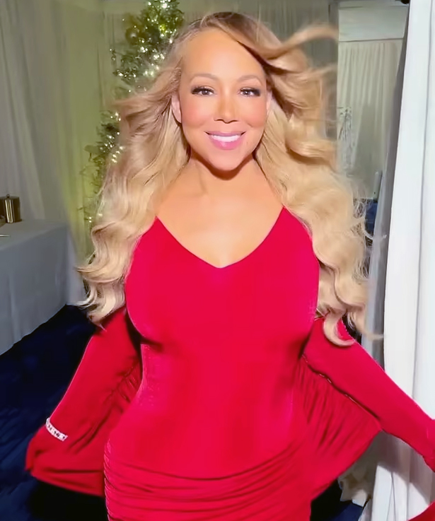 Mariah Carey stuns in red to mark first day of December | mcarchives.com