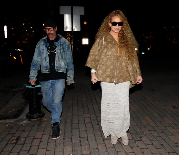 Mariah Carey vacations in platform taupe suede booties | mcarchives.com