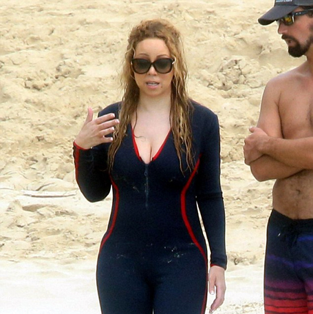 Mariah Carey displays her figure in plunging wetsuit | mcarchives.com