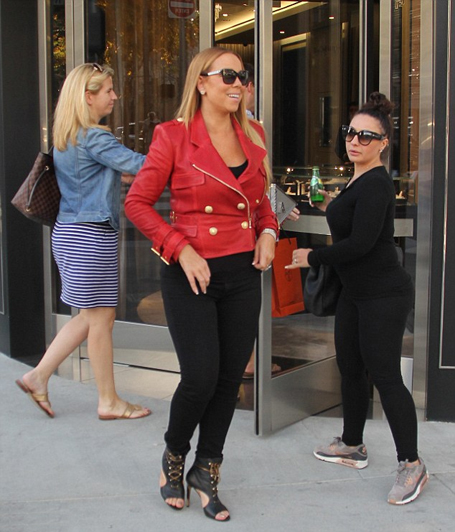 Mariah Carey rocks a glamorous red leather jacket | mcarchives.com